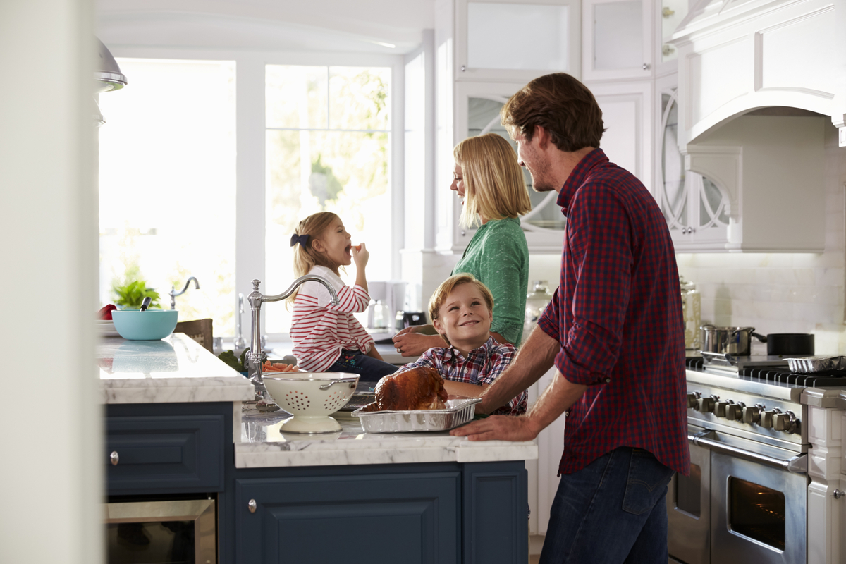 Happy family in new kitchen