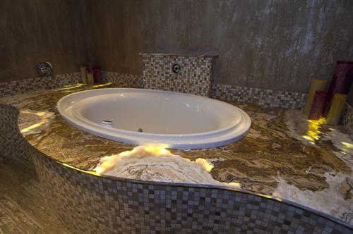 Onyx Bathtub Surround by C&D Granite